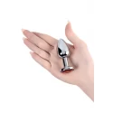 Silver anal plug with red gem