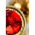 Gold anal plug TOYFA Metal with red round-shaped gem, length 7,8 cm, diameter 2,2-3,5 cm, weight 95 gr
